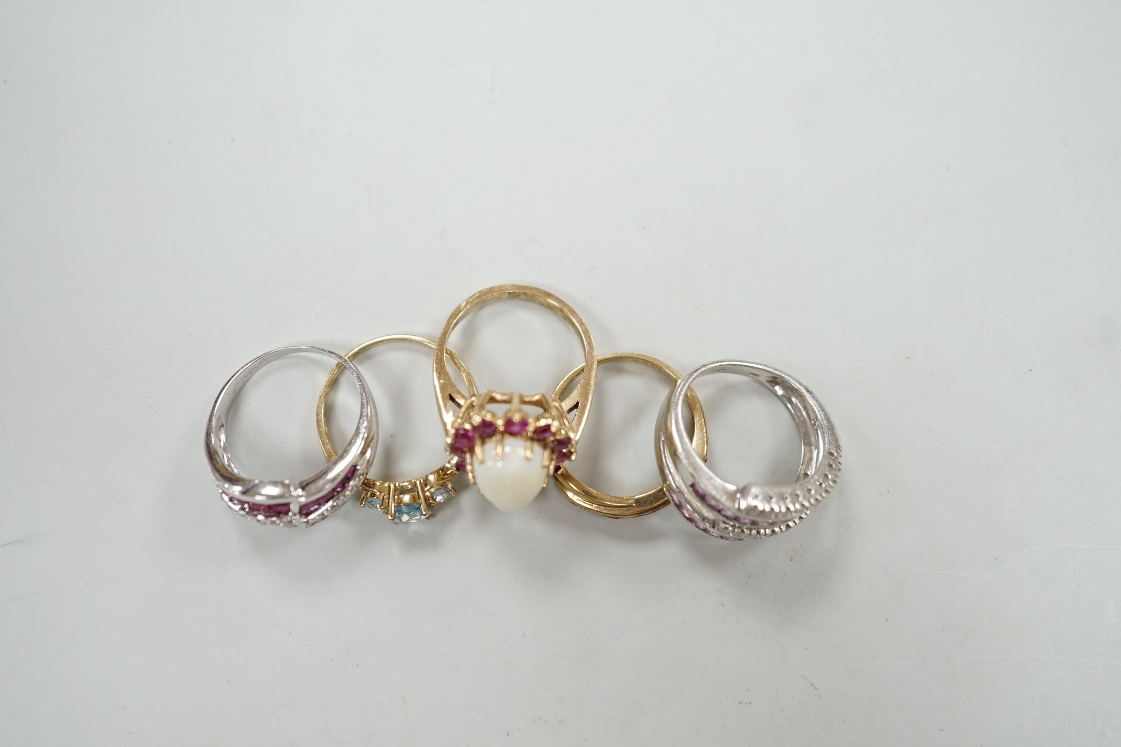 Five assorted modern 9ct gold and gem set dress rings, including ruby and diamond chip, gross weight 16.8 grams.